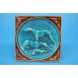 A Minton Hollins and Company single tile depicting two lurchers and a hare.  15 cm x 15 cm