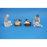 Two Royal Doulton figures 'Alice', HN 2158, 'Treasure Island', HN 2243 and two groups of dogs in