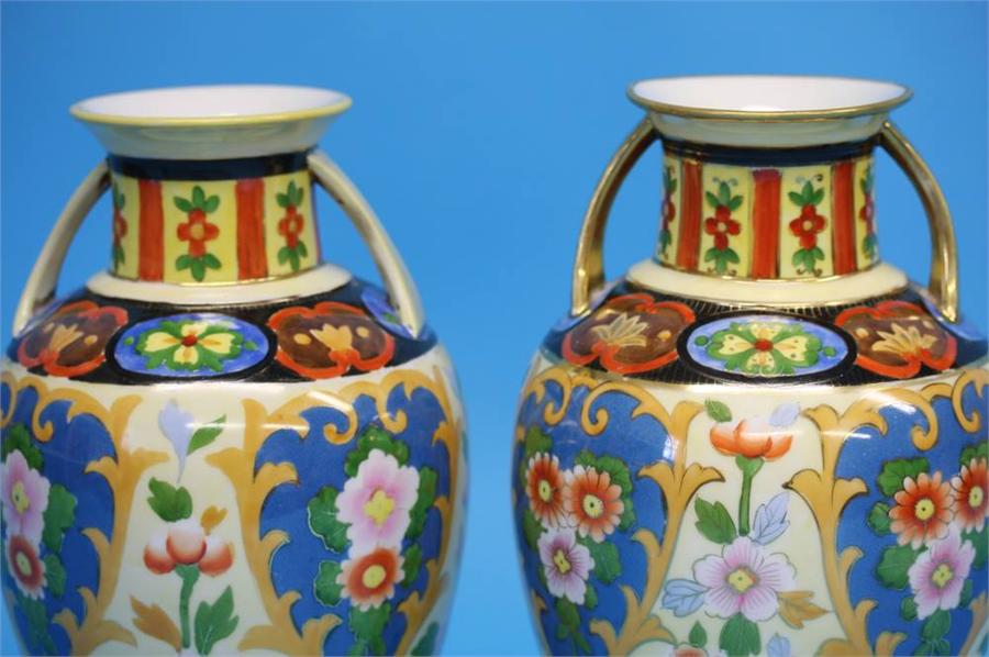 A pair of Noritake vases with gilt looped handles decorated with colourful flowers on a yellow and - Image 9 of 35