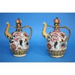 A pair of Zsolnay Pecs vases decorated with flower heads and leaves, impressed mark and printed