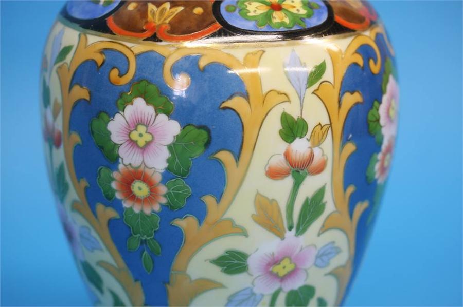 A pair of Noritake vases with gilt looped handles decorated with colourful flowers on a yellow and - Image 32 of 35