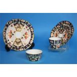 A Royal Crown Derby Imari tea service comprising; two cake plates, six side plates, six cups and