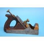 A smaller Norris of London brass, wood and steel wood plane, stamped Norris of London.  24 cm long