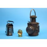 A Hailwood and Ackroyd Limited of Morley, Leeds oil burning lamp and two other lamps.