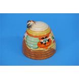 A Clarice Cliff Bizarre 'Nasturtium' pattern beehive shape honey pot and cover, black printed mark.