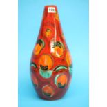 An Anita Harris Art Pottery vase on a red ground, decorated with geometric panels.  10 cm high