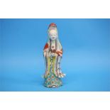 A Chinese figure of a female Deity with poly-chrome decoration.  24.5 cm high