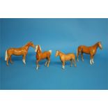 Four Beswick Palomino horses.