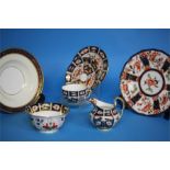 A Royal Crown Derby Imari cup and saucer, sugar bowl, cream jug, three side plates, a pair of