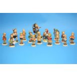 A Collection of sixteen Hummel figures, various.