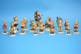 A Collection of sixteen Hummel figures, various.