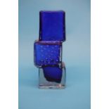 A modern copy of a Drunken Bricklayer blue glass vase.  21.5 cm high