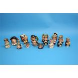 A Collection of nine Royal Doulton 'Doultonville' figures, four medium size Character jugs and