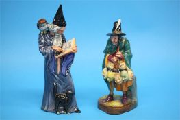 Two Royal Doulton figures 'The Wizard', HN 2877 and 'The Mask Seller', HN 2103. (2)