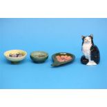 A Royal Doulton cat, HN999, two small Moorcroft circular dishes and an ash tray. (4)