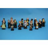 A Collection of sixteen Royal Doulton Charles Dickens figures including 'Scrooge', 'Bill Sikes',