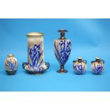 A Royal Doulton vase with two looped handles on a white ground decorated with blue Iris and