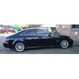 A Mercedes CLS 55 AMG 4 door 4 seat coupe, black, 2005, 5.5 litre, V8 supercharged engine.  Full
