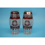 A pair of early 20th century Bohemian red flashed and hob nail cut glass vases.  22 cm high