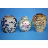 A Chinese Canton enamelled ginger jar and cover and two other ginger jars (no lids), various sizes.