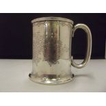 Edwardian silver tankard, applied hollow cast handle, Profuse foliate decoration with central