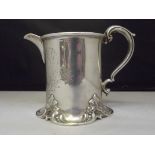 Victorian silver cream jug, engraved floral decoration with scroll work to the base, signs of