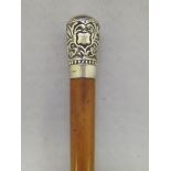 Edwardian malacca swagger stick, the silver knop with stylised foliage, London, 1909,J Howell & Co