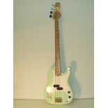 A guitar signed by John Entwistle from "The Who" With COA. Guitar length 117cm.