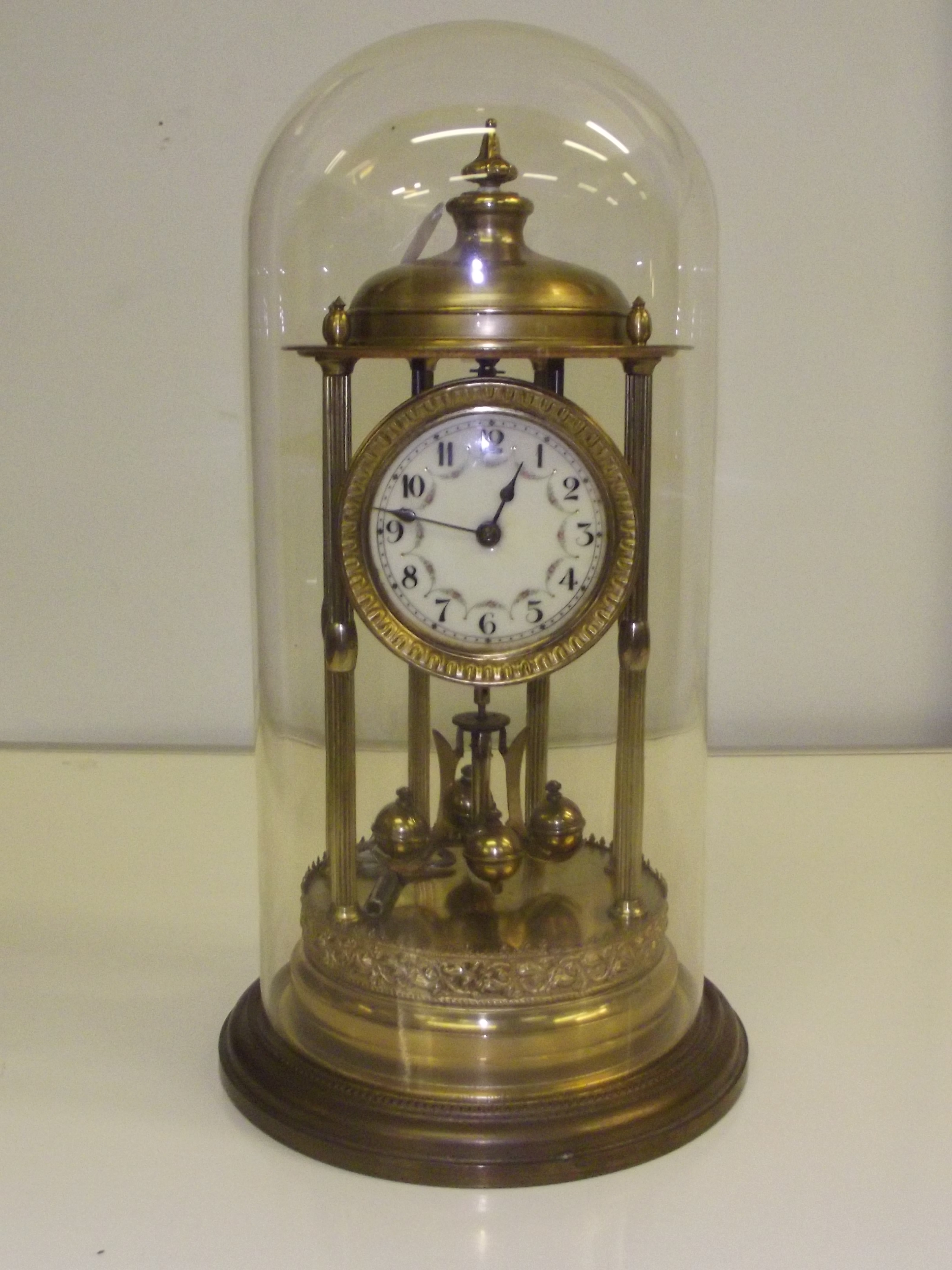 Large early 20th century anniversary clock with glass, height of clock 38 cm