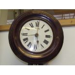 A early 20th century postman's clock with two weights and pendulum.