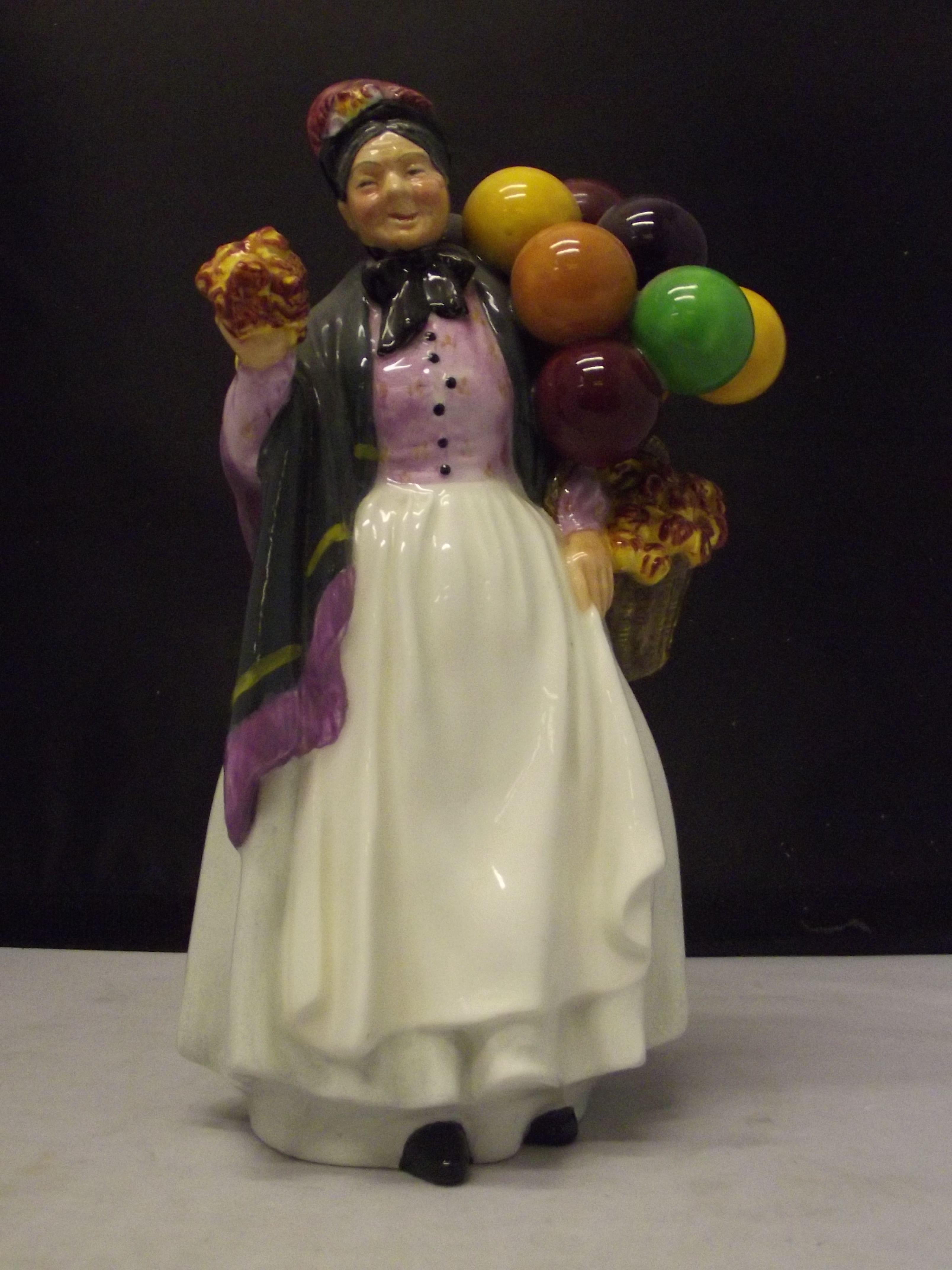 Royal Doulton figure 'Biddy Pennyfarthing, HN 1843, 23cm in height