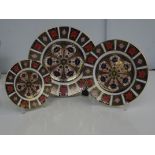 Three Royal Crown Derby Old Imari pattern plates 1128. Largest 27cm diameter