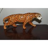 A Beswick figure of a leopard, model number 1082, designed by Arthur Gredington, 12 cm in height.