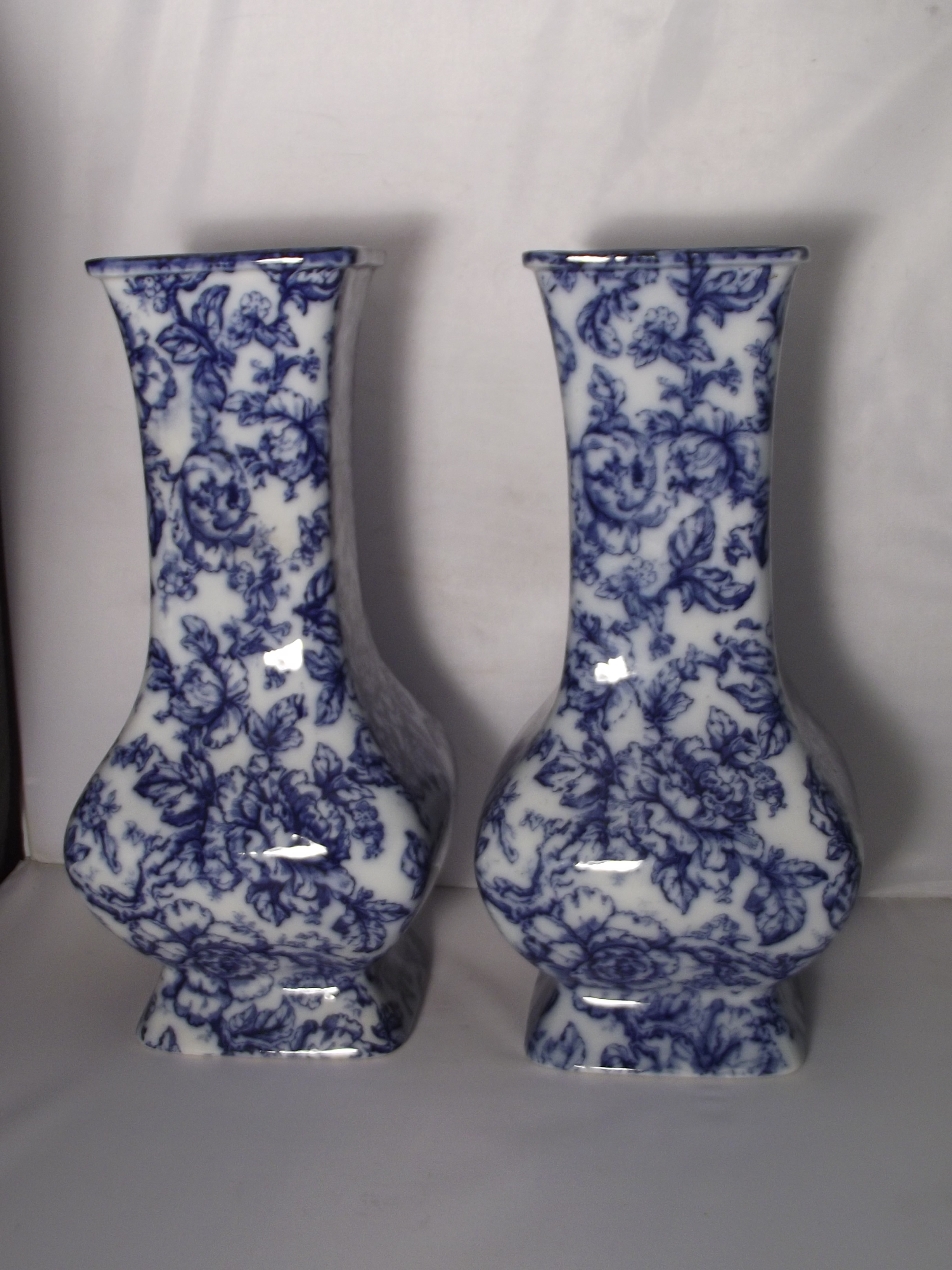 A pair of Losol blue and white vases of square baluster form, decorated in the cavendish.