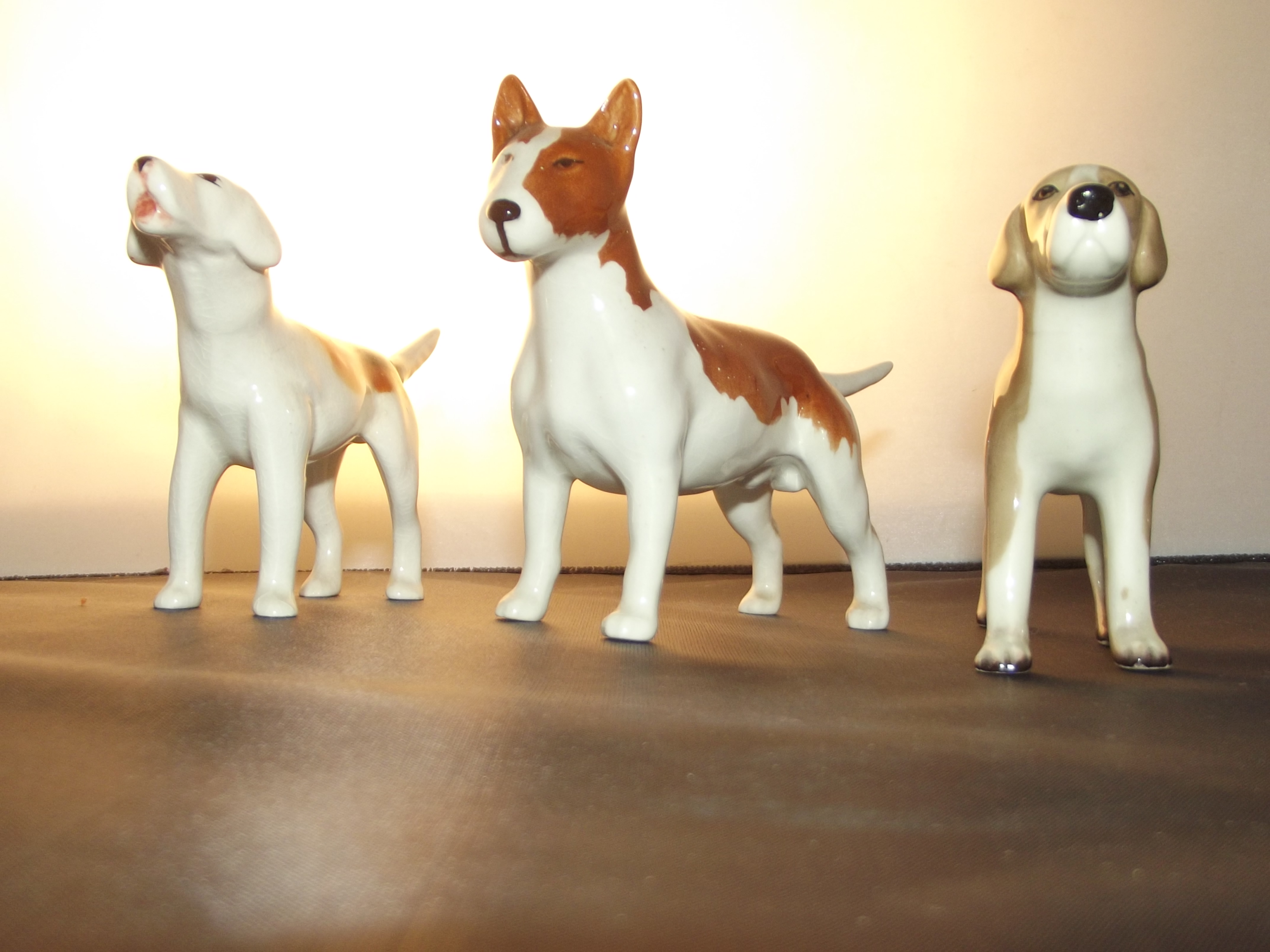 Beswick old English terrier, Beswick fox hound and one other midwinter dog.