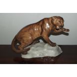 A Beswick figure of a Puma, perched on a rock, 21 cm in height, model number 1702, glazed.