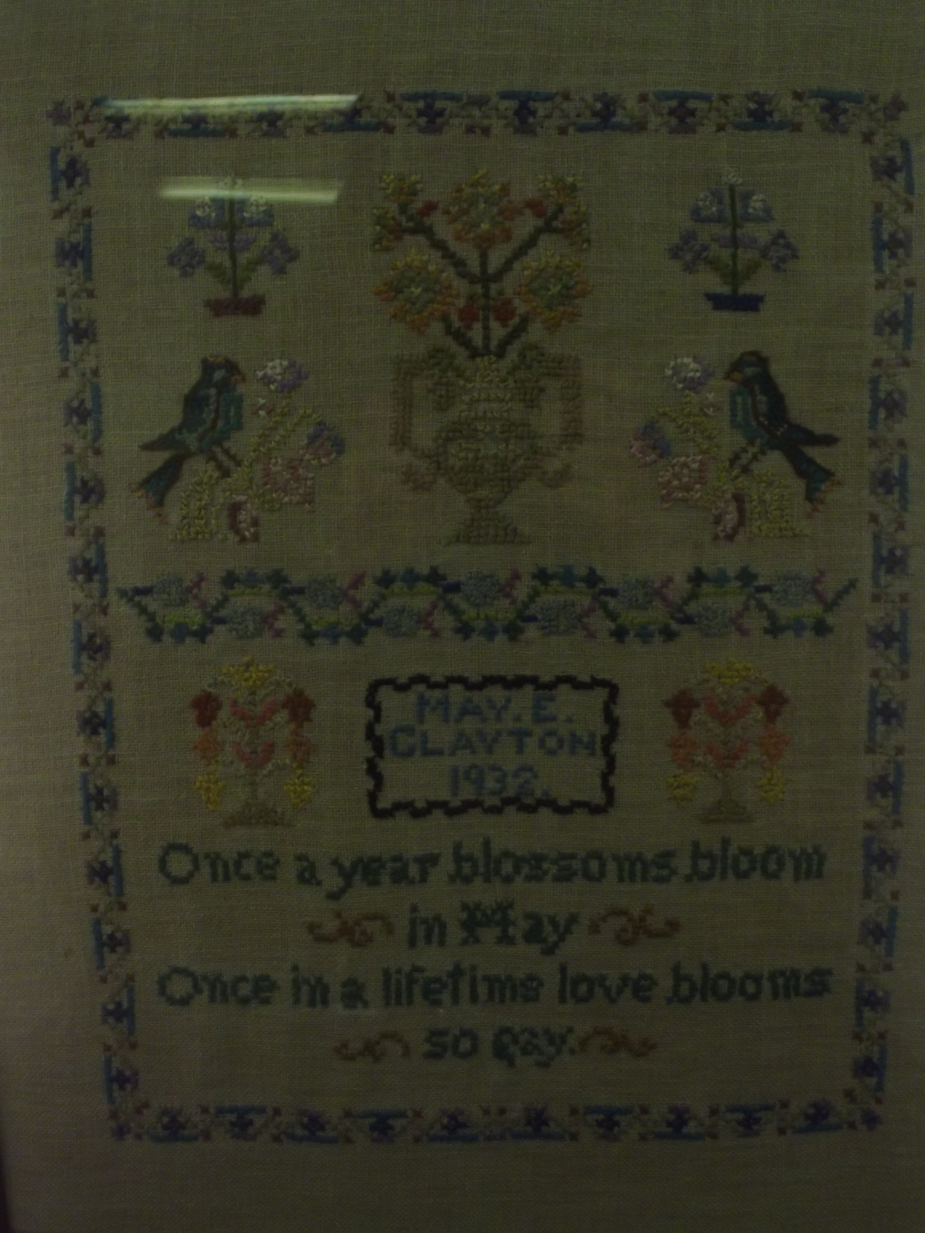 A 1932 needlework sampler. 45X38 cm including frame.