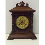 Ansonia eight day mantel clock, with old trade label inside back door, oak case and gilt dial, in