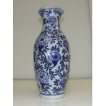 An early 20th century Chinese vase with blue floral design.