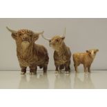 Beswick Highland trio comprising - Highland Bull, cow and calf. Height of Bull 13cm