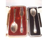 A boxed silver spoon and folk and a boxed spoon, Sheffield 1909