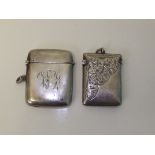 Two Edwardian silver vesta cases, one of plain form (Birmingham, 1903) together with one with