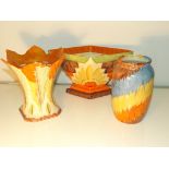 Three colorful art deco pieces of pottery. Two flower boats and a vase. Myott son & co and two