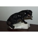 A Beswick puma on a rock, model number 1823, black gloss, 14 cm in height.