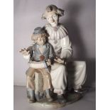 Large Nao figure of a clown with boy, 30cm in height