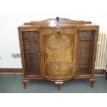 Good quality walnut display cabinet, bow front cupboard enclosing five drawers, astragal glazed
