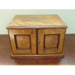 incomplete canteen of Edwardian cutlery in a military style walnut case enclosing four drawers