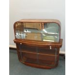 Art deco cocktail cabinet, siding glass doors and mirrored serving slide, walnut cased with mirror