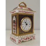 Royal Crown Derby carriage clock in the 1128 pattern, height 19cm