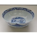 Export Chinese blue and white bowl, deep foot rim, depicting mountain and lake scene, floral